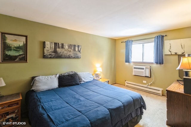 bedroom with a wall mounted air conditioner, carpet floors, and a baseboard heating unit