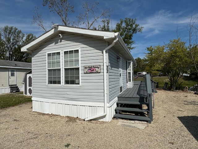 view of home's exterior featuring a deck