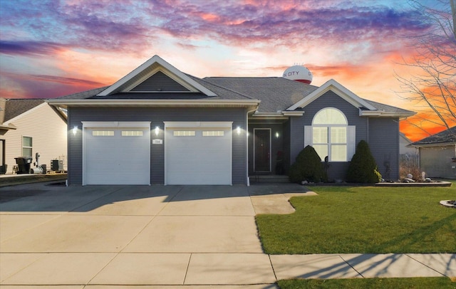 single story home featuring a yard, central AC unit, driveway, and a garage