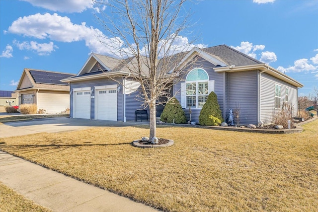 ranch-style home with a front yard, an attached garage, and driveway