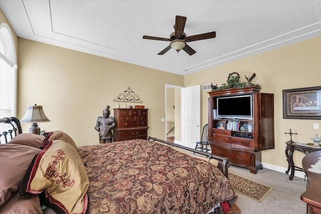 carpeted bedroom featuring visible vents, ceiling fan, and baseboards