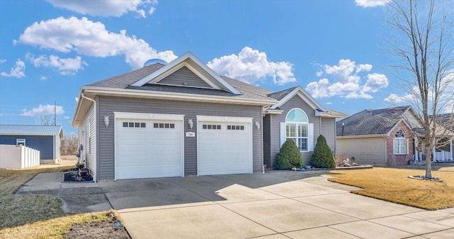 ranch-style house with a front yard, an attached garage, driveway, and a shingled roof