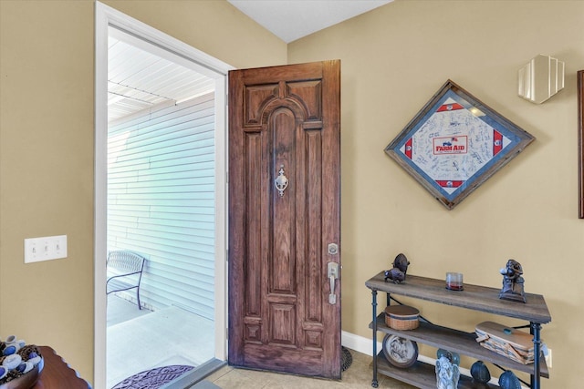 entrance foyer with light tile patterned flooring