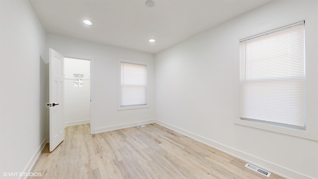 spare room with light hardwood / wood-style floors