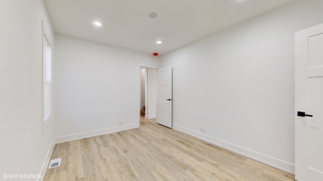 unfurnished room with light hardwood / wood-style flooring