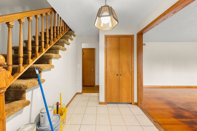 foyer entrance featuring light tile patterned flooring