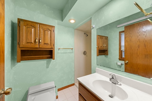 bathroom with tile patterned floors, vanity, and toilet