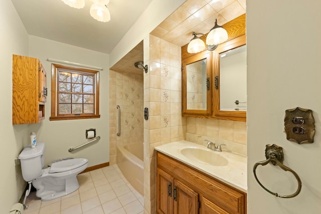 full bathroom with tile patterned floors, backsplash, toilet, vanity, and tiled shower / bath