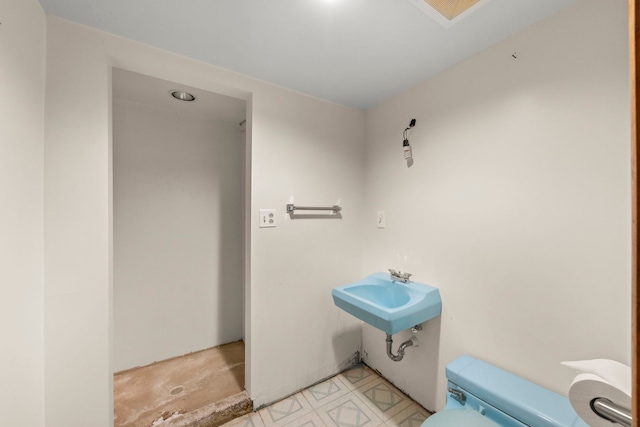 bathroom with toilet and sink