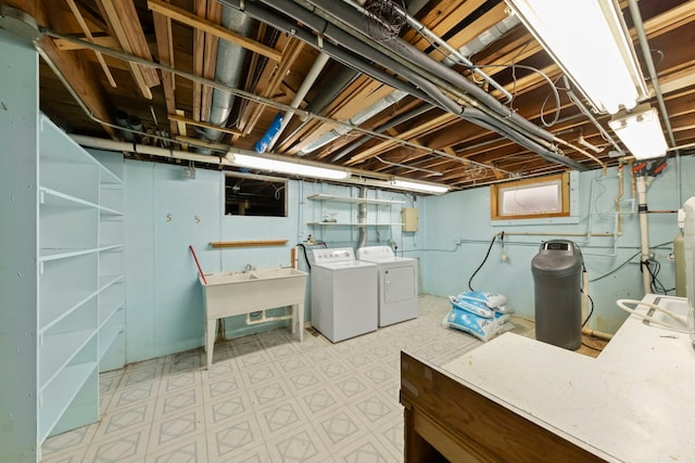 basement featuring washing machine and clothes dryer