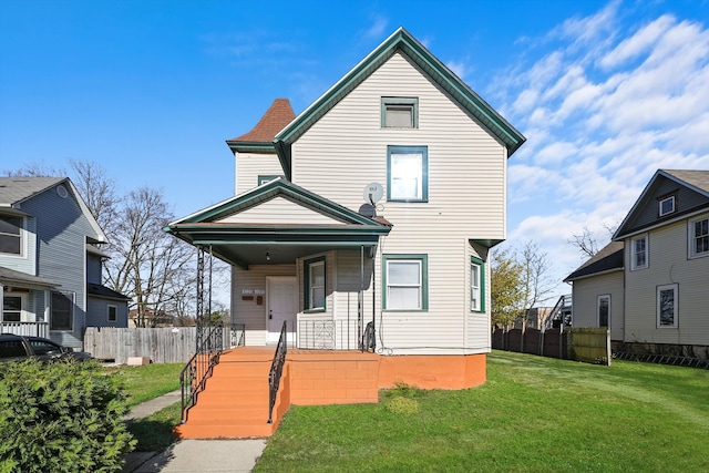 view of front of property featuring a porch and a front lawn