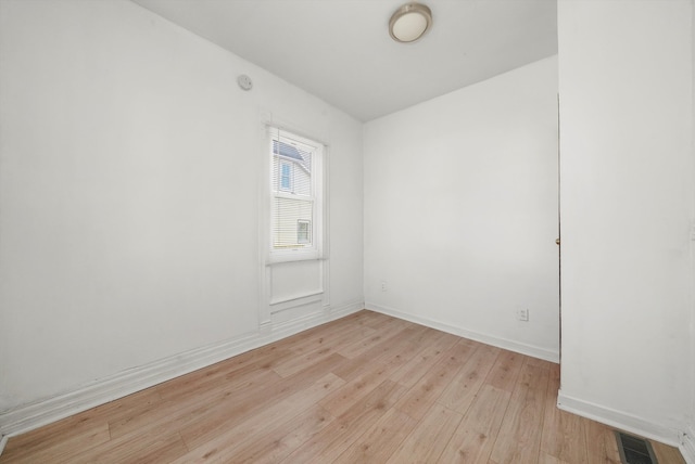 unfurnished room with light hardwood / wood-style flooring