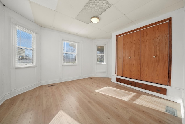 spare room featuring light hardwood / wood-style floors