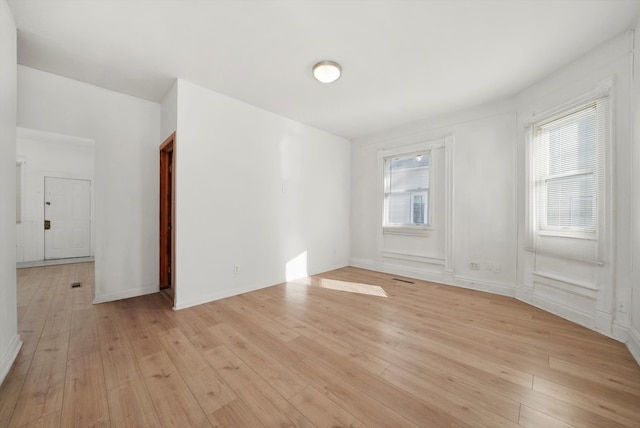 spare room with light wood-type flooring