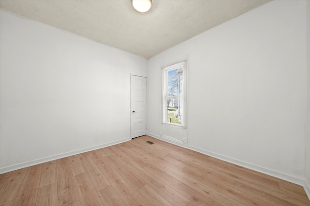 unfurnished room featuring light hardwood / wood-style floors