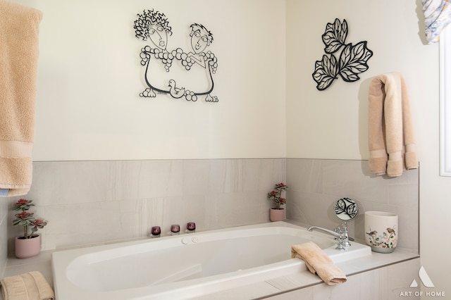 bathroom featuring tiled bath