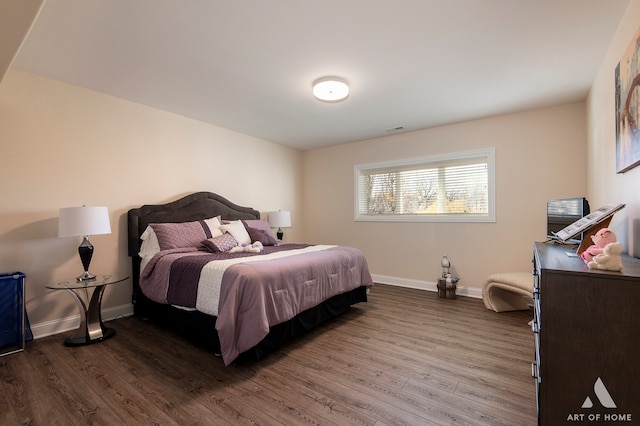 bedroom with wood-type flooring