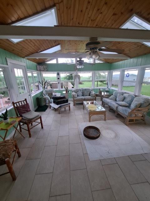 1522 E 7th Rd, Lostant, IL 61334 - sunroom / solarium with lofted ceiling with beams, an outdoor living space, and a ceiling fan