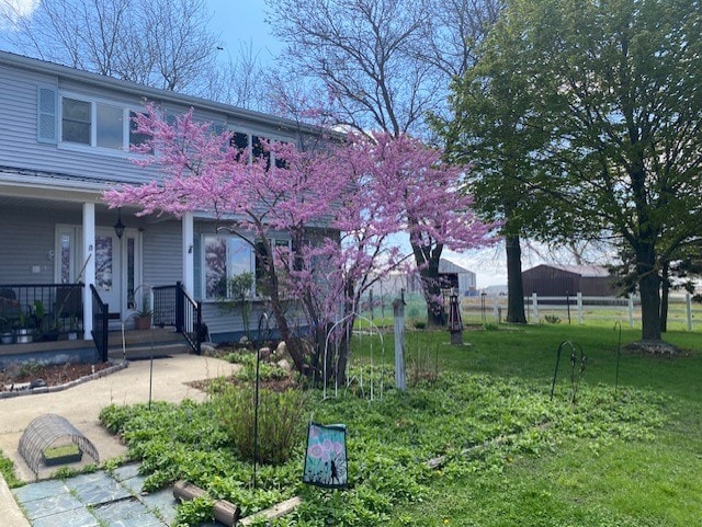 1522 E 7th Rd, Lostant, IL 61334 - exterior space featuring fence and a porch