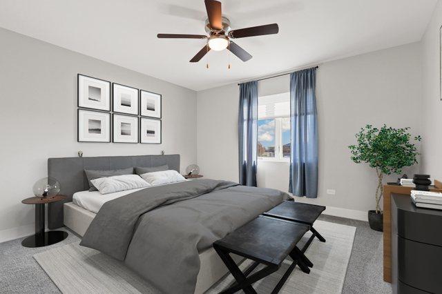 carpeted bedroom with ceiling fan