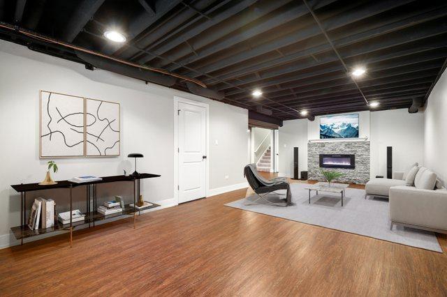 living room with hardwood / wood-style floors and a fireplace