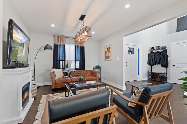 living room with dark hardwood / wood-style flooring