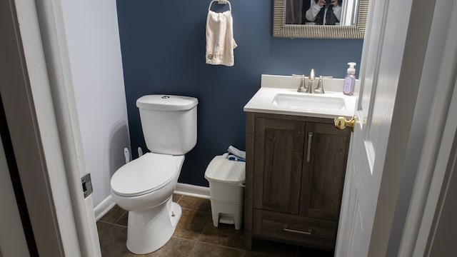 bathroom with tile patterned floors, vanity, and toilet