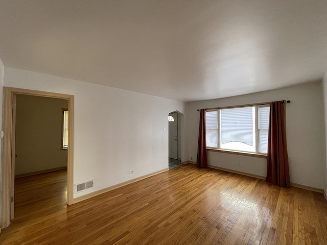 spare room featuring light hardwood / wood-style flooring