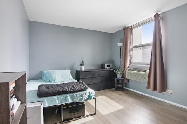 bedroom with light hardwood / wood-style flooring