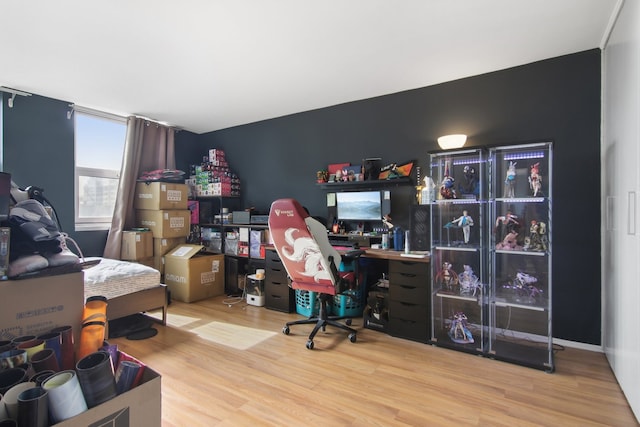 office space with wood-type flooring