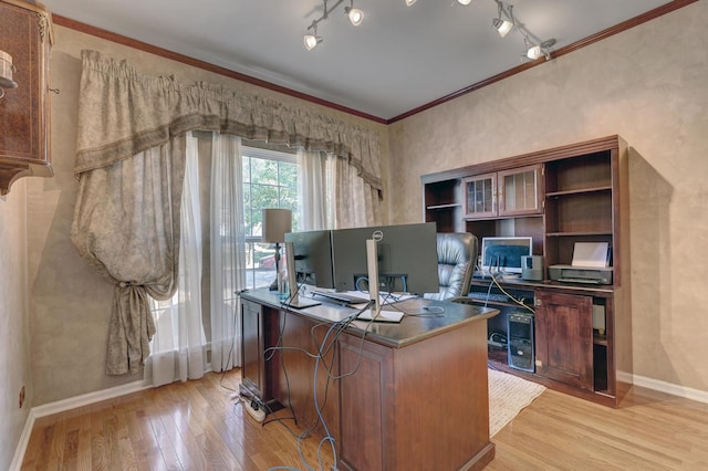 home office featuring light wood-type flooring and crown molding