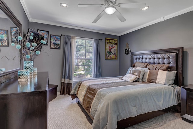 carpeted bedroom with ceiling fan and ornamental molding