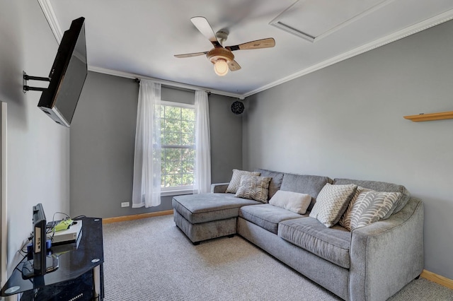 carpeted living room featuring ceiling fan and ornamental molding