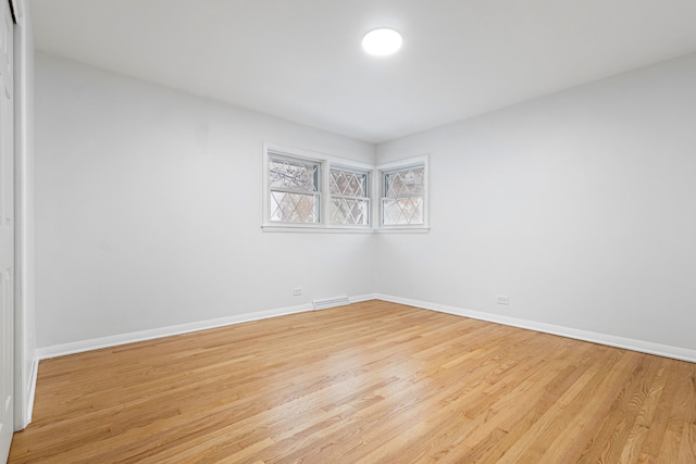 spare room featuring light wood-type flooring