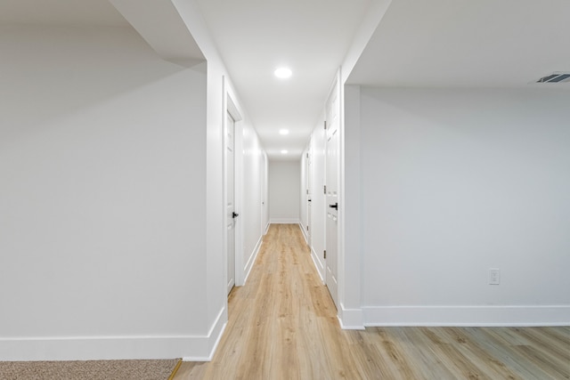 corridor featuring light hardwood / wood-style floors