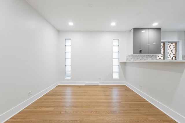 unfurnished room featuring light hardwood / wood-style flooring