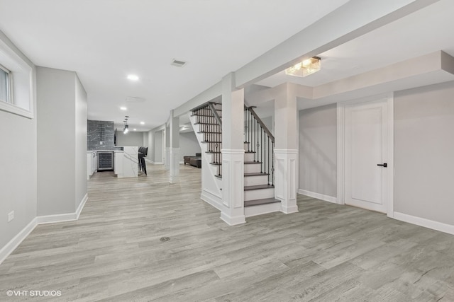 basement featuring light hardwood / wood-style floors