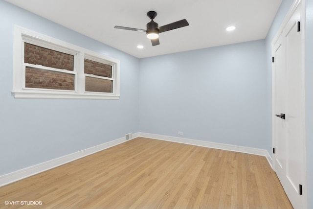 unfurnished room with ceiling fan and light hardwood / wood-style flooring