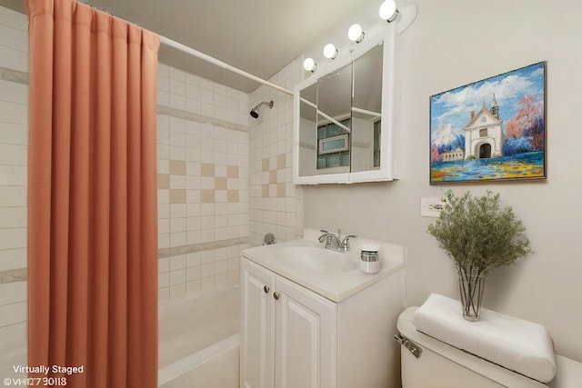 full bathroom featuring shower / bath combo, vanity, and toilet