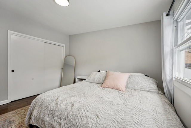 bedroom featuring a closet and hardwood / wood-style floors