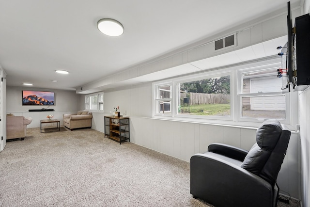 living area featuring carpet