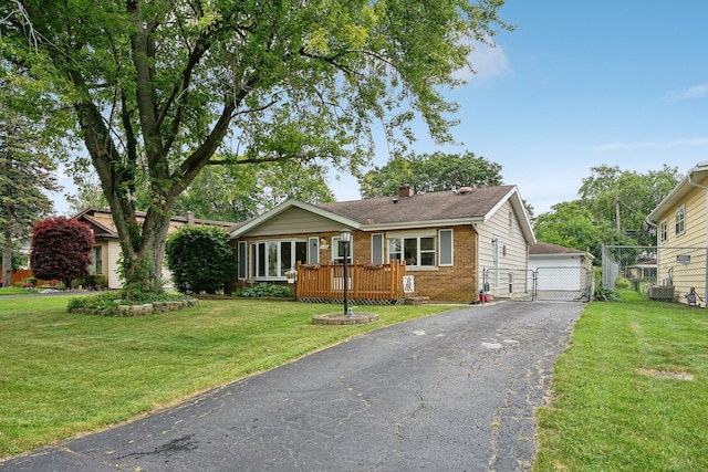 ranch-style home with a deck and a front yard