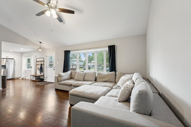 living room featuring ceiling fan, dark hardwood / wood-style flooring, and lofted ceiling