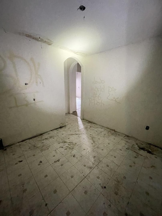 6922 S Lowe Ave, Chicago, IL 60621 - unfurnished room with tile patterned floors and arched walkways