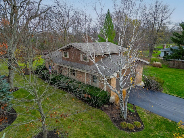 view of side of property with a yard