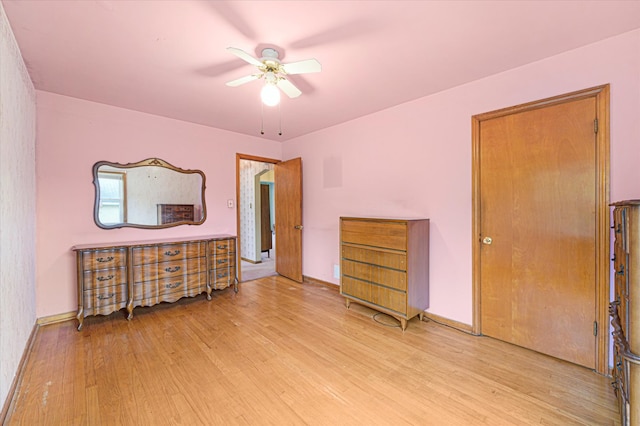 bedroom with light hardwood / wood-style floors and ceiling fan