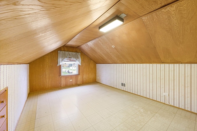 bonus room with wood walls, wooden ceiling, and lofted ceiling