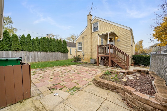 back of property with a patio