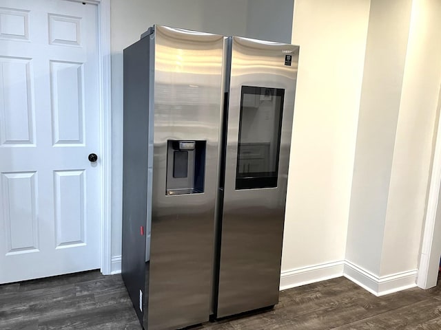 kitchen with stainless steel refrigerator with ice dispenser and dark hardwood / wood-style floors