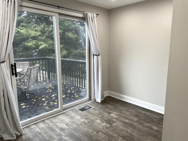 empty room featuring hardwood / wood-style flooring